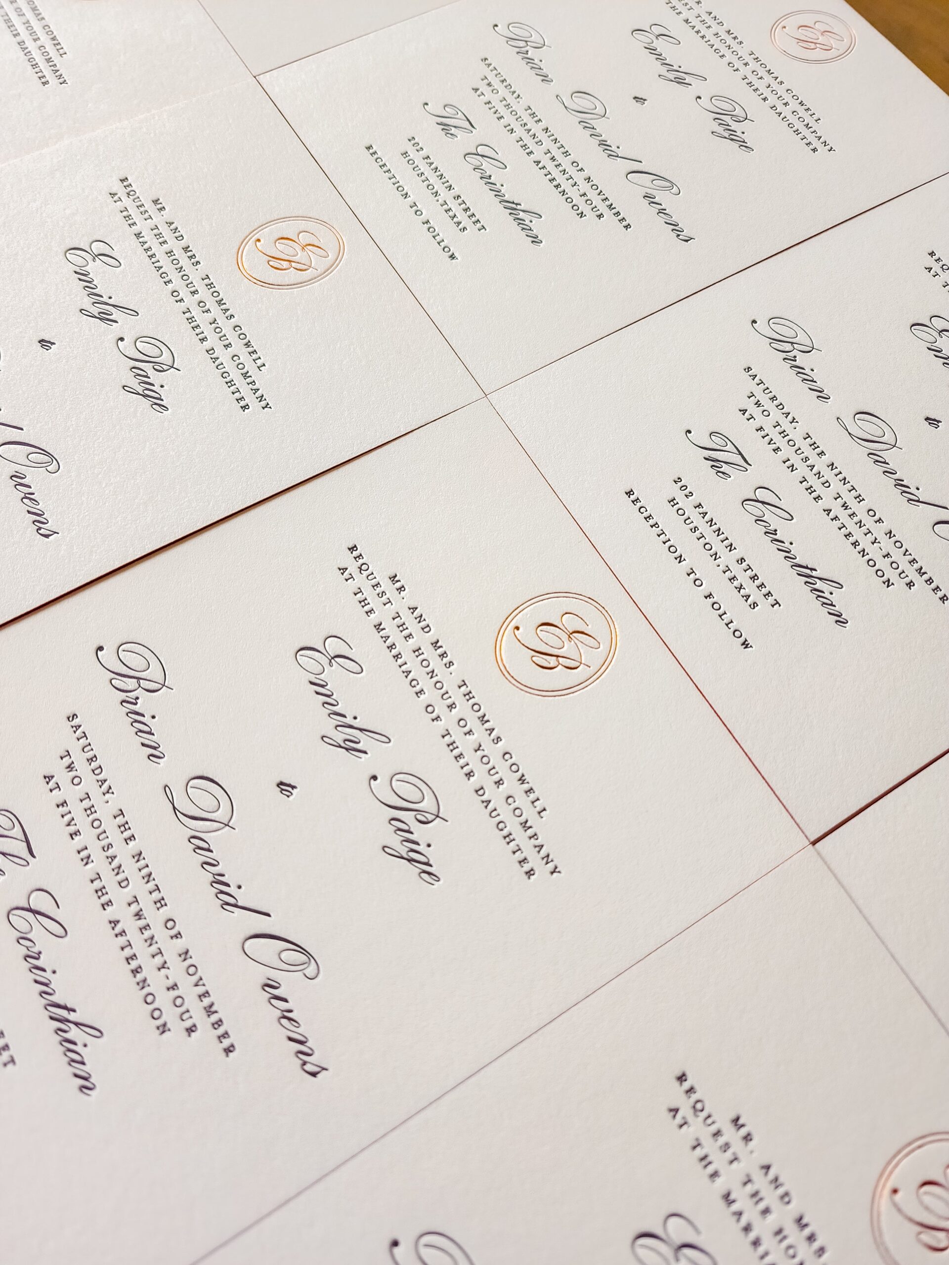 Close-up of embossed details and printed lettering on wedding paper