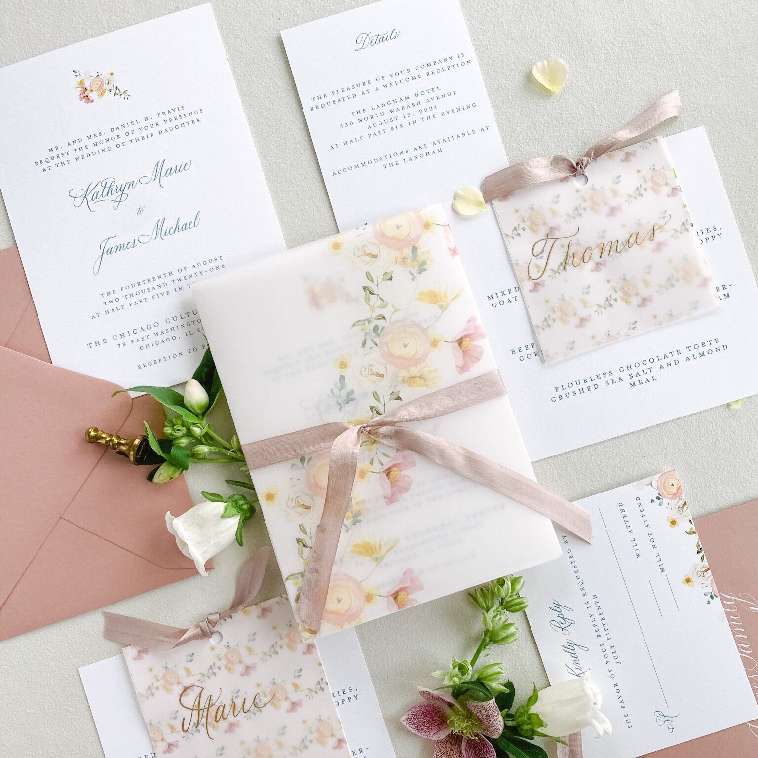 Floral wedding invitation with a translucent wrap and soft pink envelope