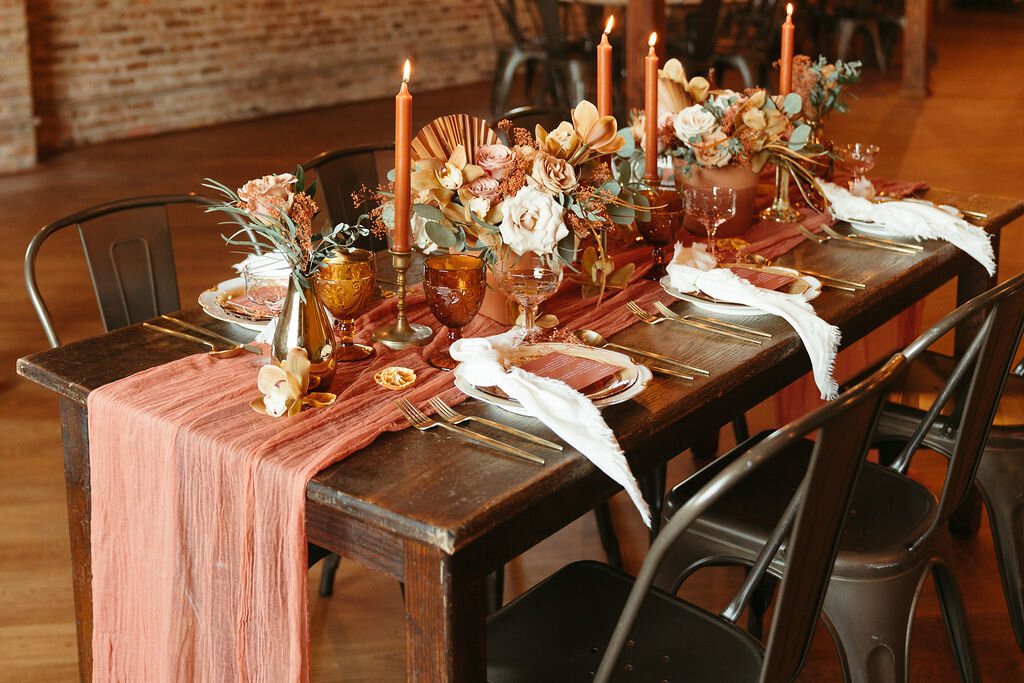Warm autumn wedding tablescape with a persimmon menu at The Haight