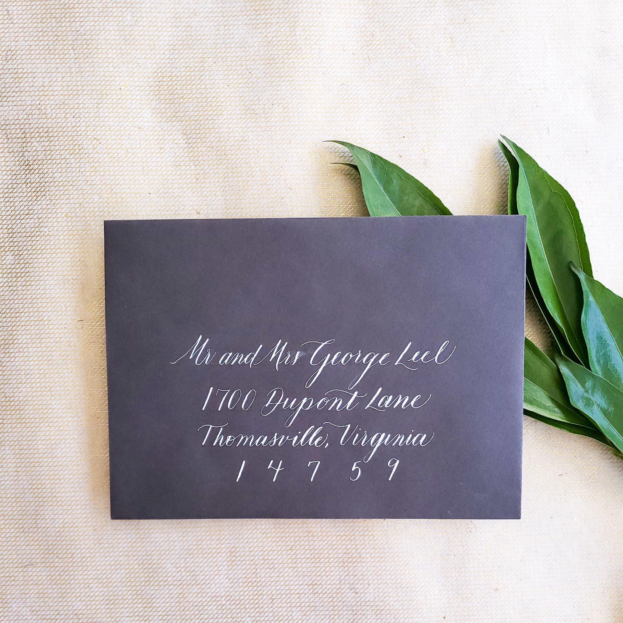 Dark wedding welcome sign with pale calligraphy