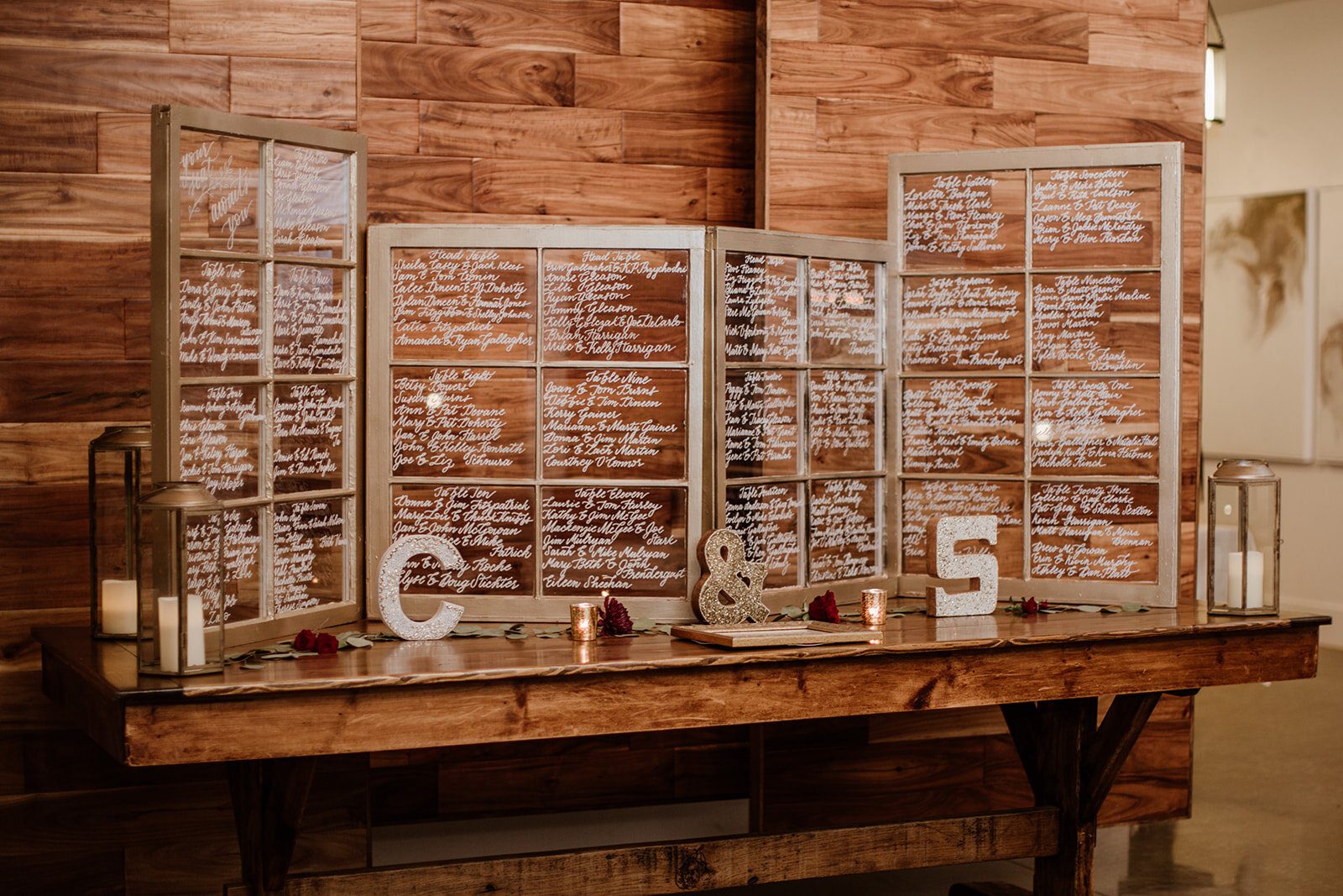 Vintage window seating chart with hand-lettered names at Pear Tree Estate