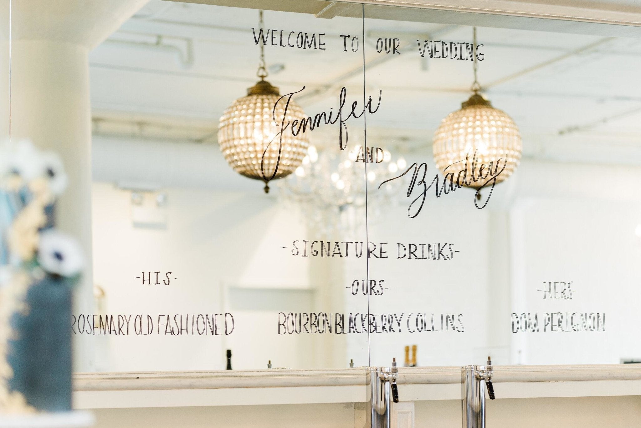 Welcome message and signature cocktails lettered on the Room 1520 bar mirror