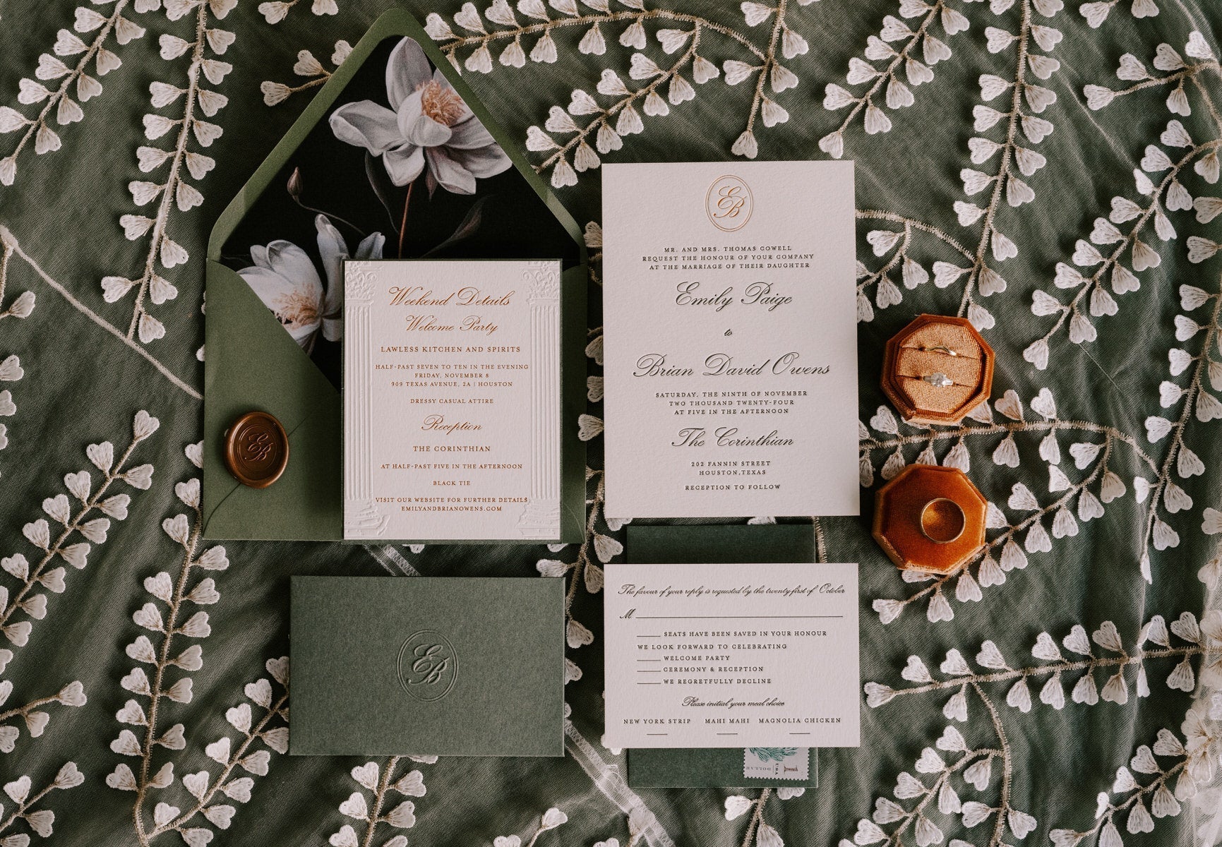 Wedding invitation, response card, and details card in a styled arrangement